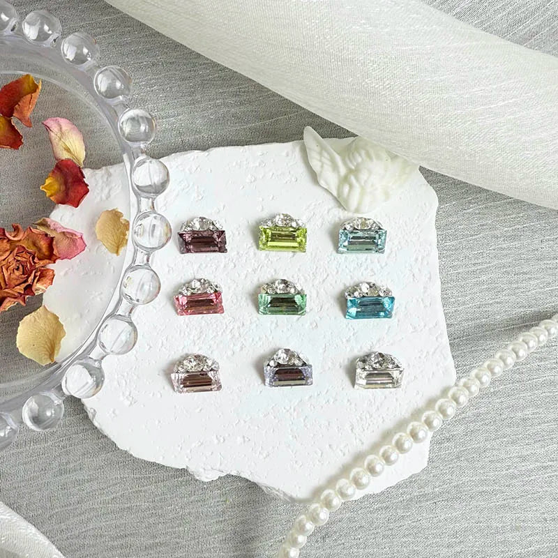 Clear rectangular nail crystals close-up for salon, press-on, and DIY manicure use