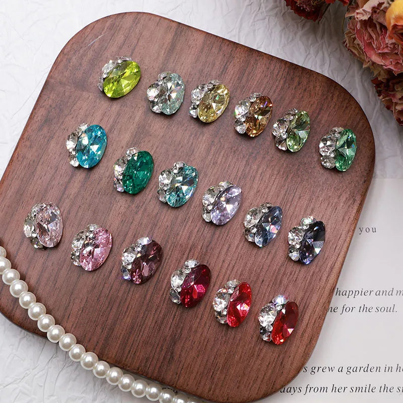 Close-up of faceted oval rhinestone appliques for nail art, bridal crafts, and decorative DIY projects