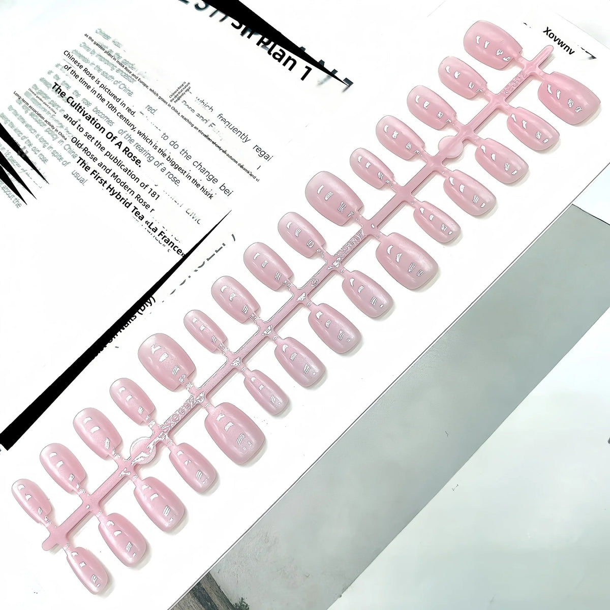 Close-up view of the light-catching shimmer on solid-color press-on nail tips