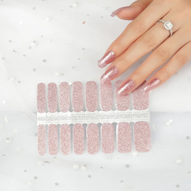 Multicolored glitter nail polish strips and solid nail wraps for an easy DIY manicure