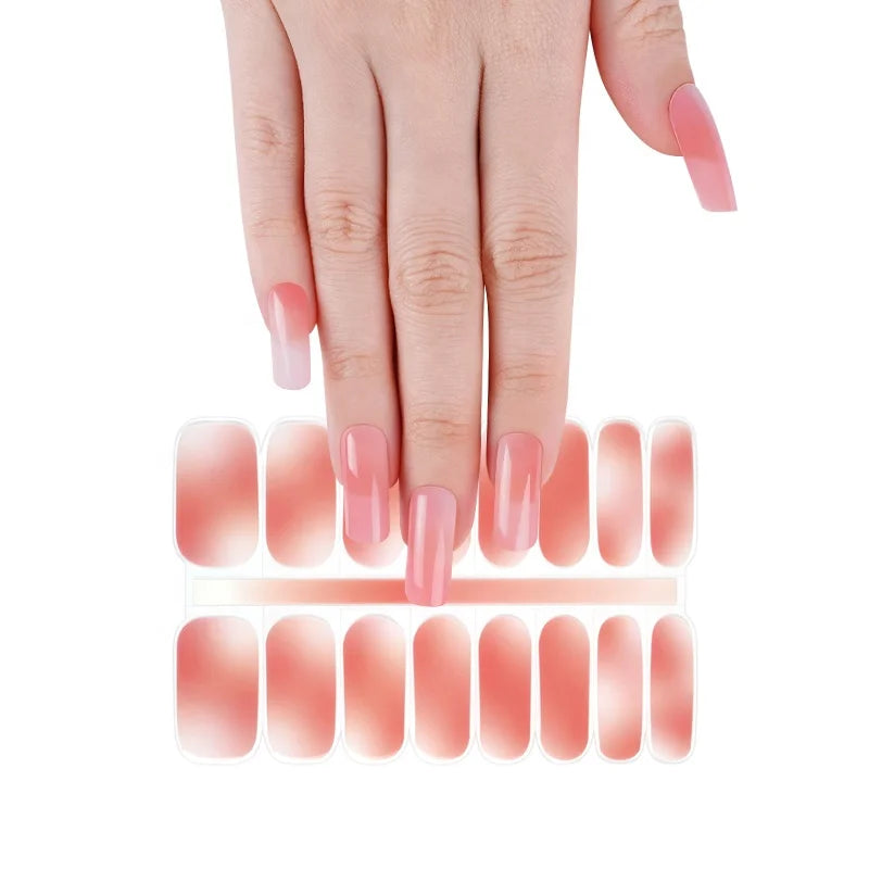 Close-up of colorful water transfer nail decals for at-home manicure and party nail looks