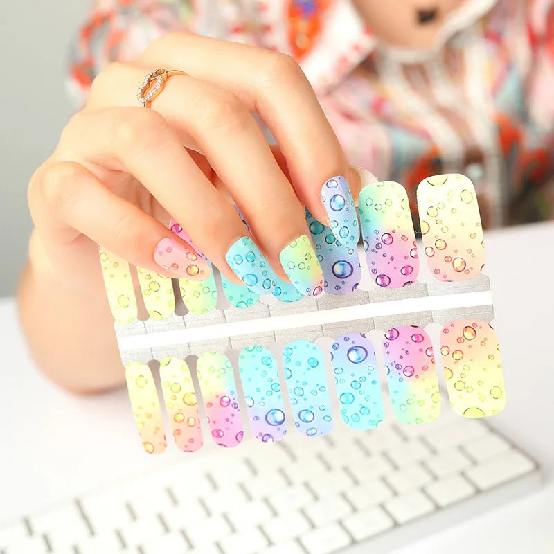 Neon bubble nail wraps featuring bright peel-off nail polish strips for festival-inspired DIY manicures
