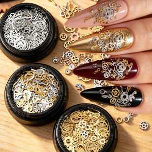 Close-up of clockwork-inspired metal charms for gothic, punk and steampunk nail designs