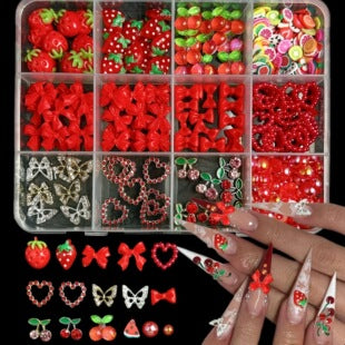 Close-up assortment of bow, heart, cherry, strawberry and sparkling nail decorations