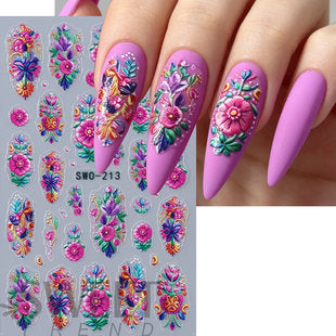 Close-up view of embroidery-inspired flower patterns on decorative nail stickers