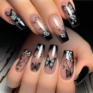 Medium-long ballerina press-on nail shape and butterfly design detail