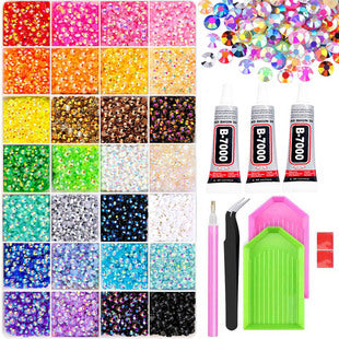 Mixed color flatback resin gems packed in a 28-compartment organizer box