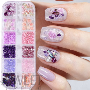 Assorted nail art gems and charms stored in a compact 12-compartment organizer box