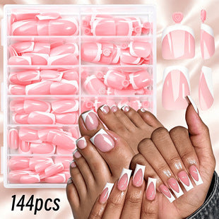 Close-up view of short nude pink French tip press on nails for everyday DIY manicure use