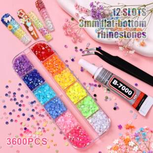 Assorted resin nail charms in a 12-grid storage box