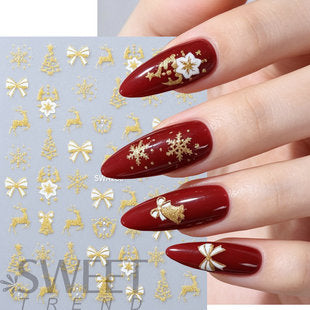 Close-up of Christmas nail sticker sheet showing festive holiday nail decal details and mixed seasonal designs