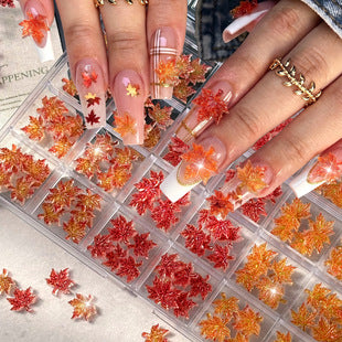 144 assorted 3D maple leaf nail charms in a 24-compartment organizer case