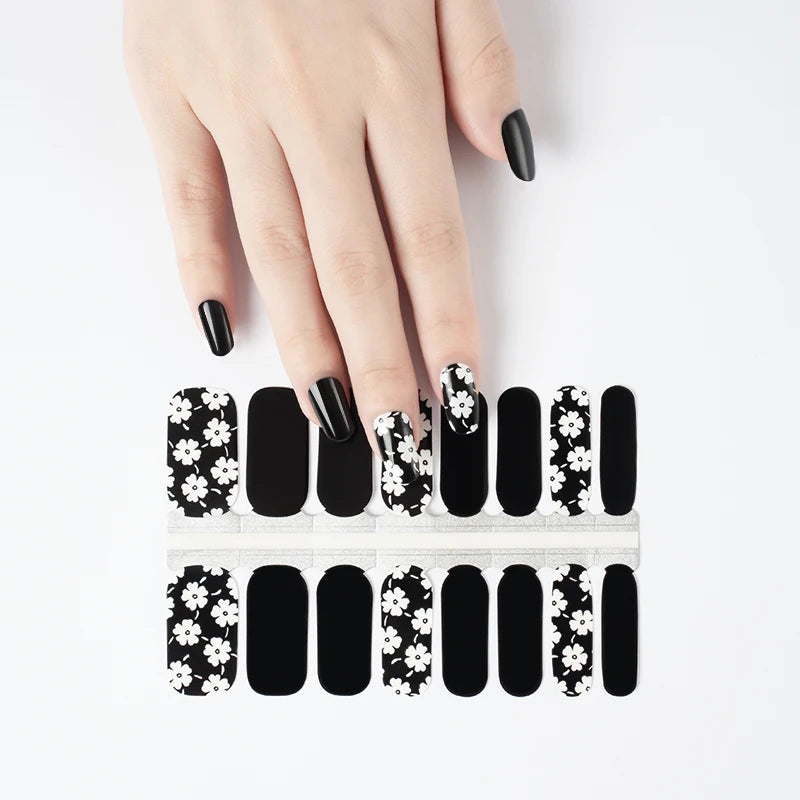 Close-up of French glitter nail stickers for at-home manicure and travel use