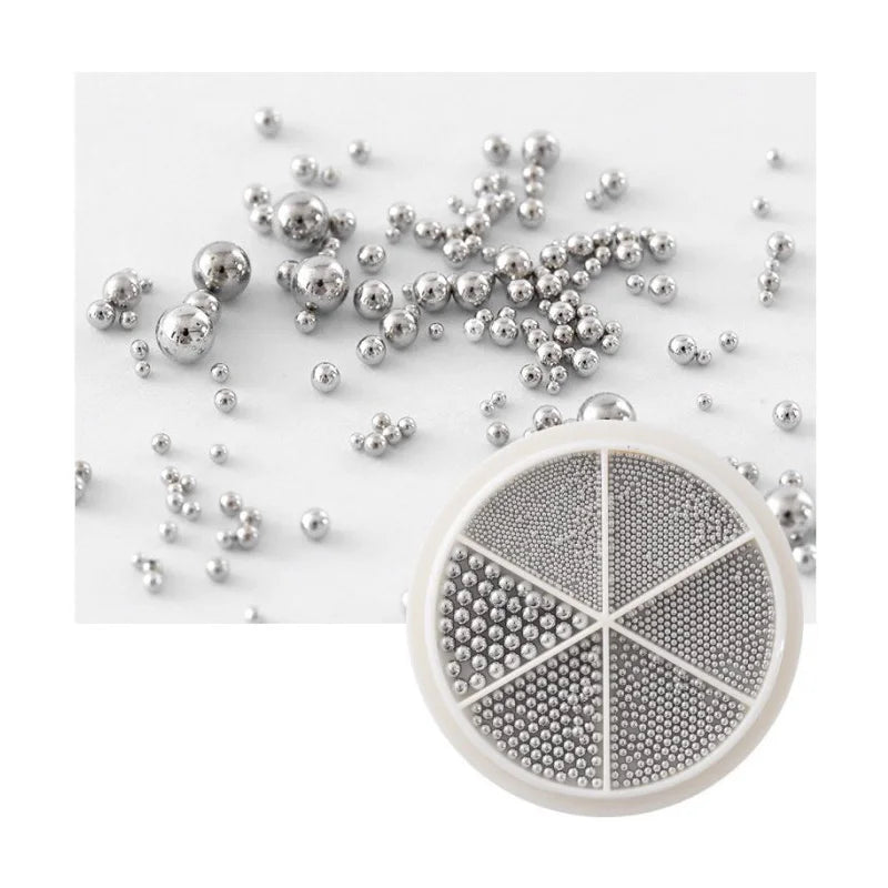 Close-up of metallic round ball beads for dimensional nail art designs
