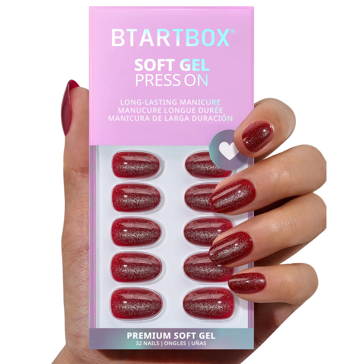 Close-up view of the glossy red cat-eye finish on short oval false nails