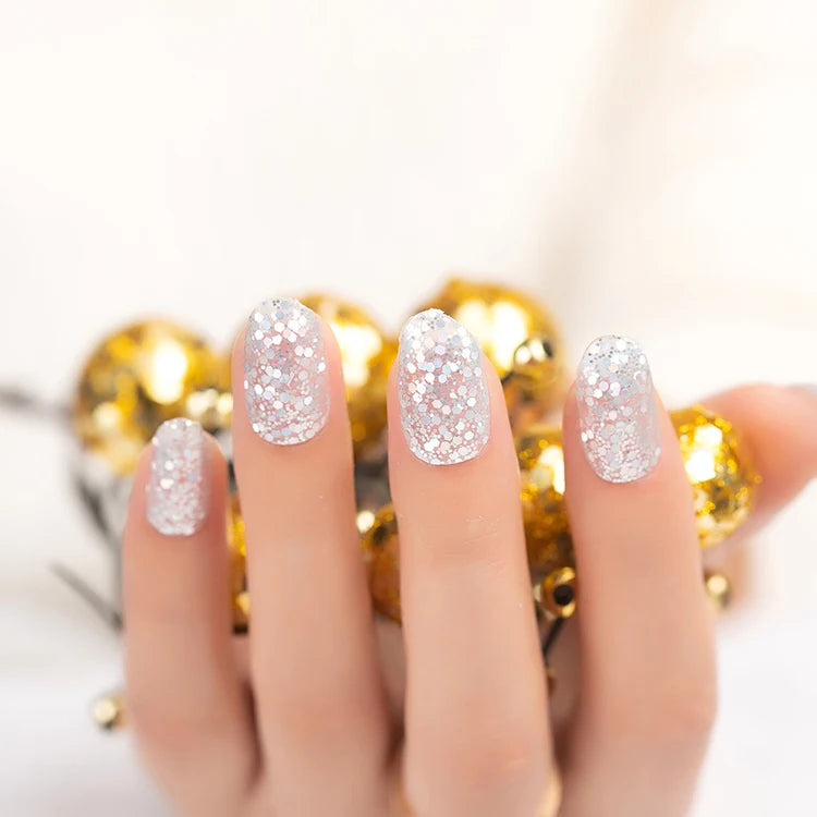 Flexible silver glitter nail wraps that can be shaped for a closer fit